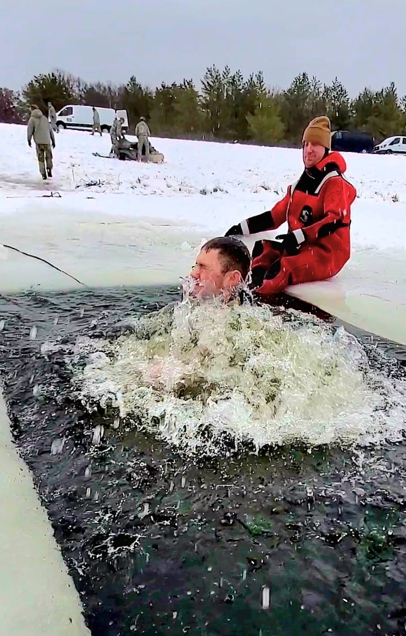 Airmen jump in for cold-water immersion training as part of Air Force-led Cold-Weather Operations Course at Fort McCoy