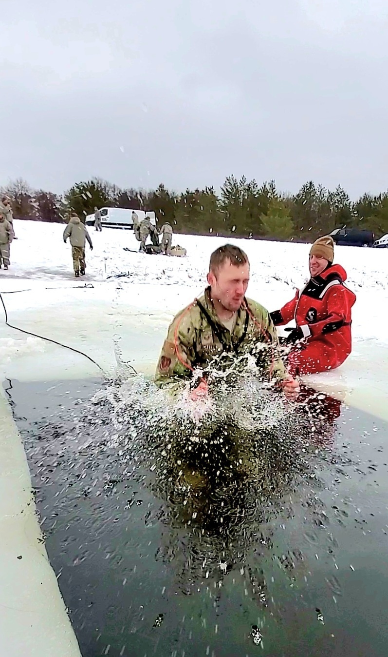 Airmen jump in for cold-water immersion training as part of Air Force-led Cold-Weather Operations Course at Fort McCoy