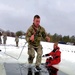 Airmen jump in for cold-water immersion training as part of Air Force-led Cold-Weather Operations Course at Fort McCoy