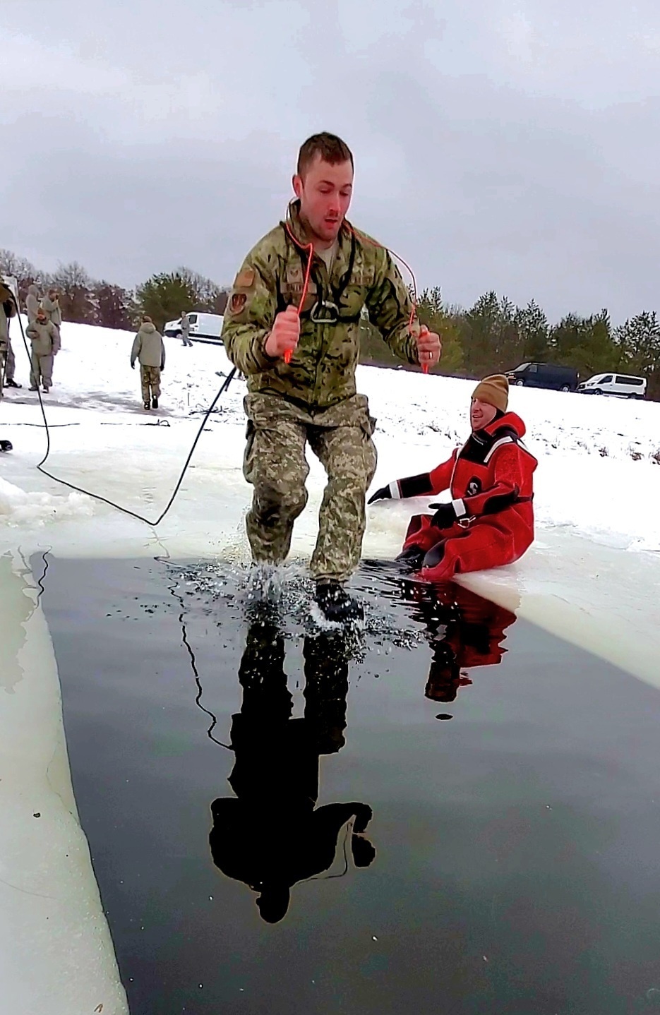 Airmen jump in for cold-water immersion training as part of Air Force-led Cold-Weather Operations Course at Fort McCoy