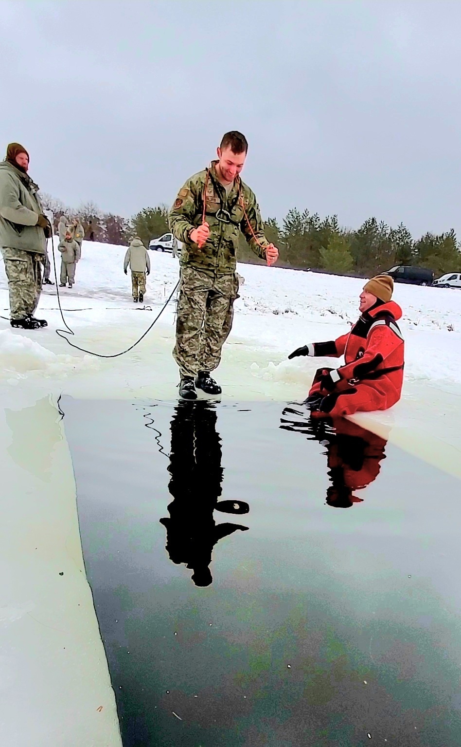 Airmen jump in for cold-water immersion training as part of Air Force-led Cold-Weather Operations Course at Fort McCoy