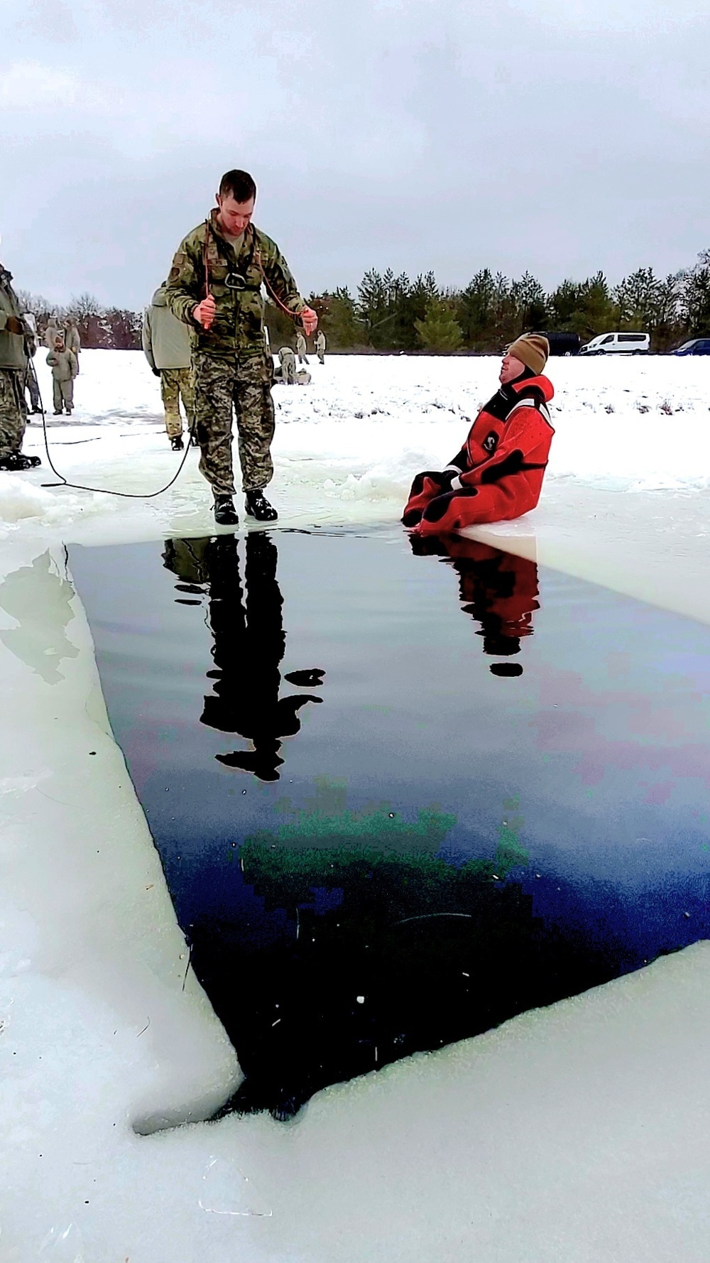 Airmen jump in for cold-water immersion training as part of Air Force-led Cold-Weather Operations Course at Fort McCoy