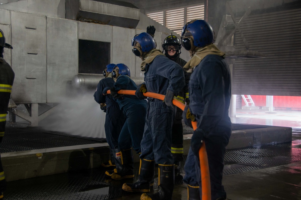 U.S. Navy Sailors participate in firefighting training