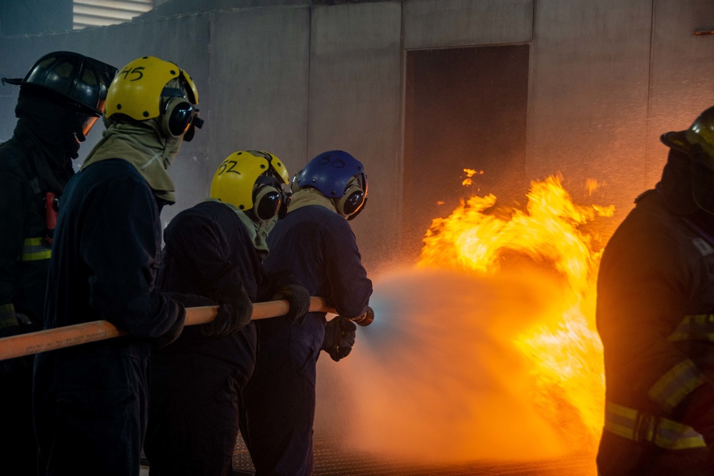 U.S. Navy Sailors participate in firefighting training