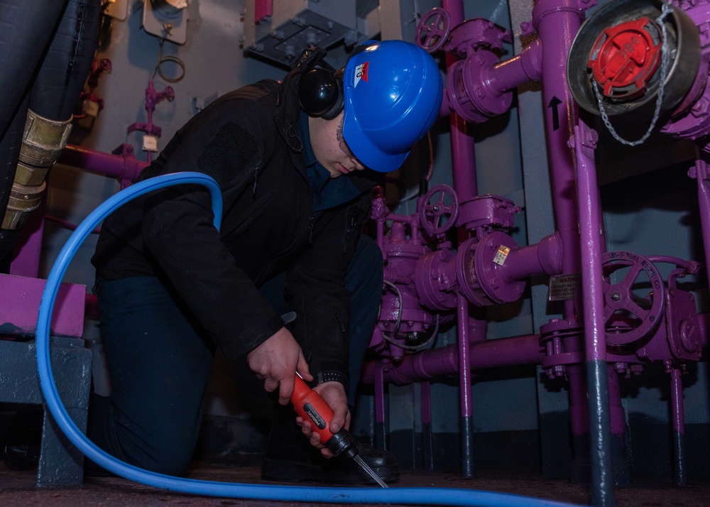 USS Ronald Reagan (CVN 76) Sailors perform deck preservation