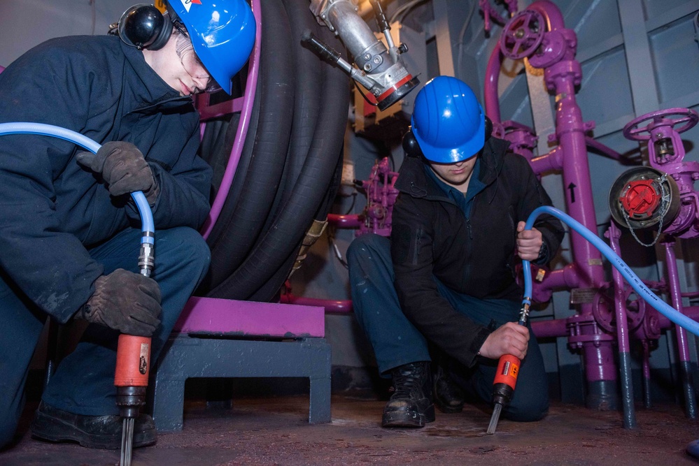 USS Ronald Reagan (CVN 76) Sailors perform deck preservation