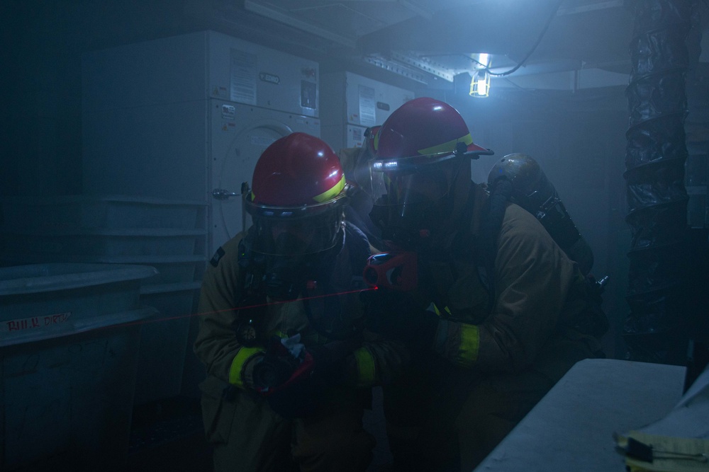 USS Ronald Reagan (CVN 76) conducts a joint damage control drill