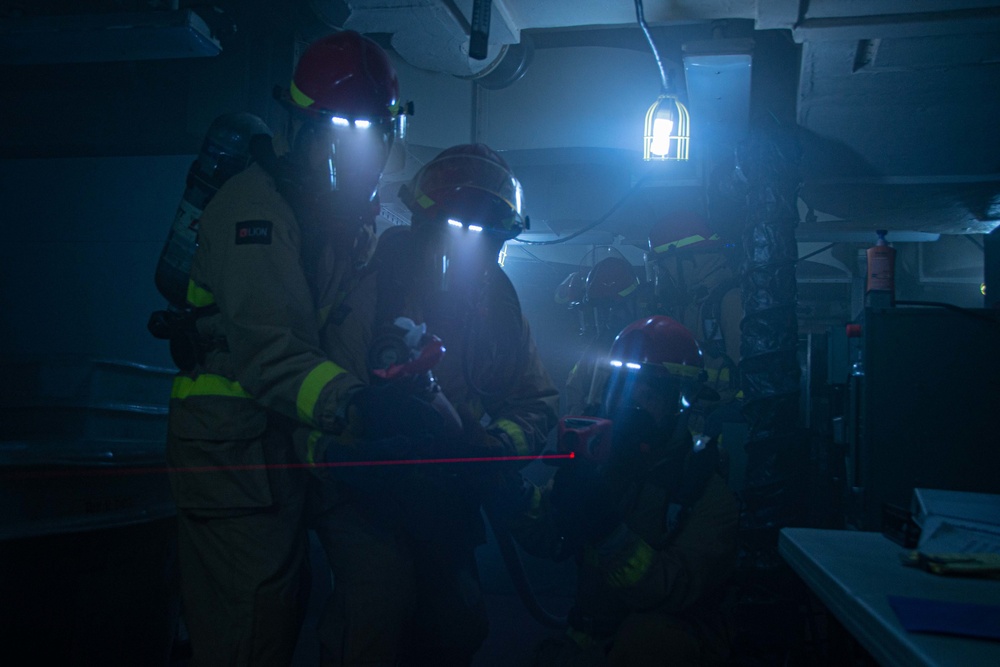 USS Ronald Reagan (CVN 76) conducts a joint damage control drill