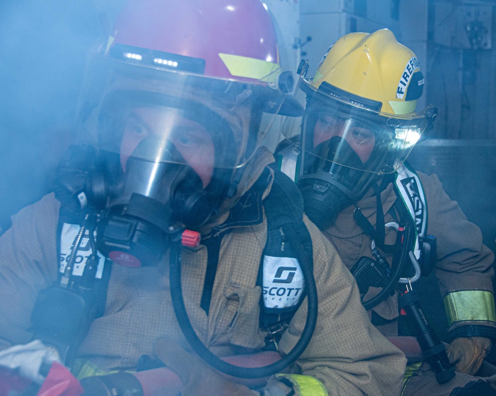 USS Ronald Reagan (CVN 76) conducts a joint damage control drill