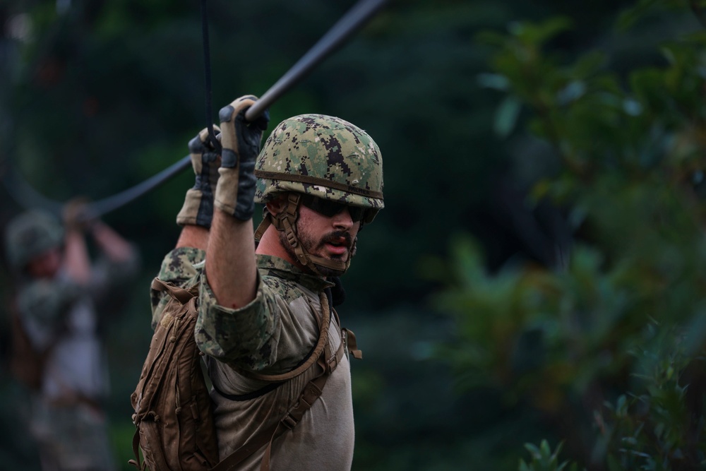 Equipment Operator 3rd Class Nickolas Spicuzza crosses 2 strand bridge.