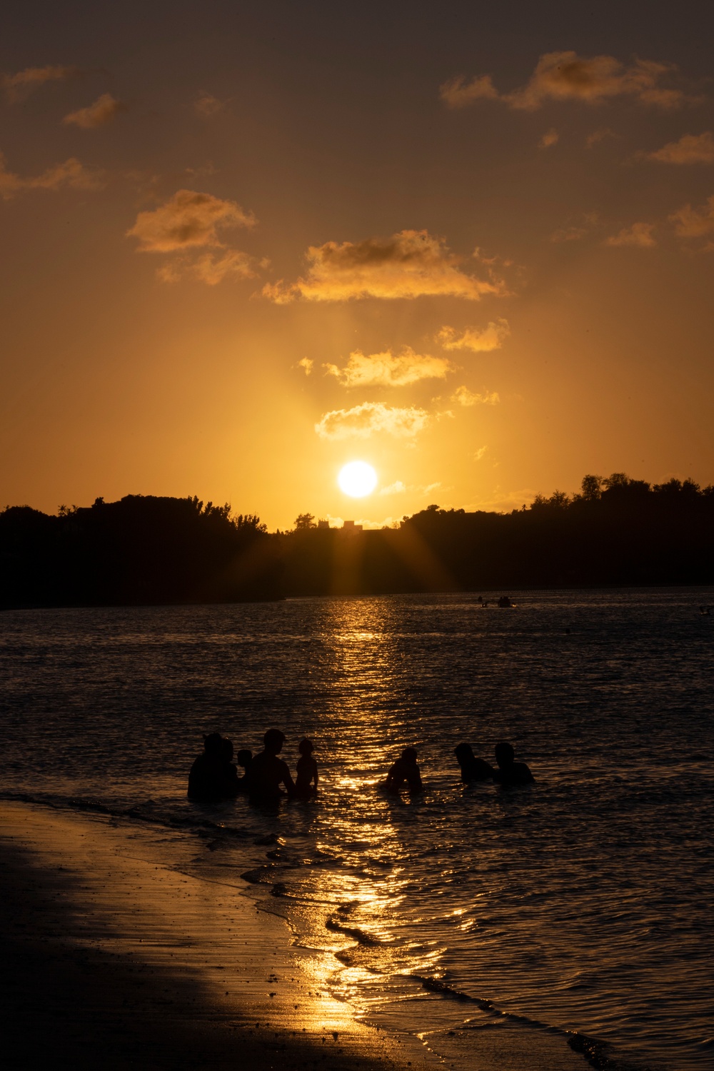 Residents and travelers visit the beaches of Guam