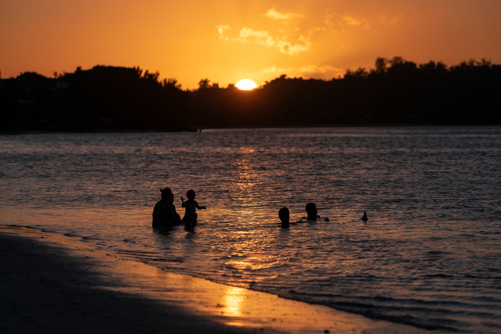 Residents and travelers visit the beaches of Guam