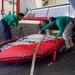 U.S. Navy Sailors Secure Aircraft Wing