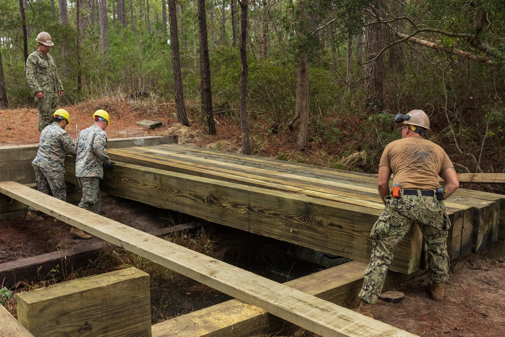 U.S. Marines with 8th Engineer Support Battalion and U.S. Navy Seabees Build a Timber Bridge during Exercise Winter Pioneer 23