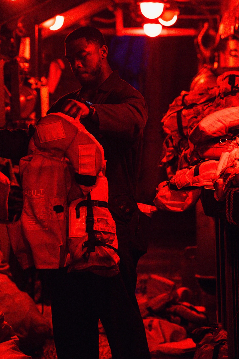 Chung-Hoon Sailor stows life jackets.