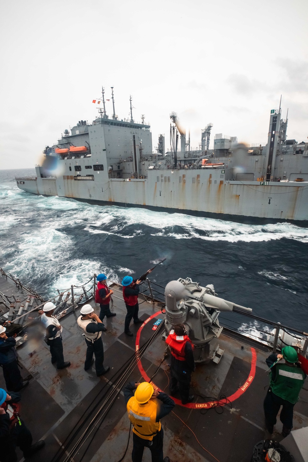 USS Chung-Hoon pulls alongside USNS Carl Brashear