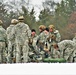 Airmen learn to build Arctic 10-person tents during cold-weather training at Fort McCoy