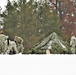 Airmen learn to build Arctic 10-person tents during cold-weather training at Fort McCoy