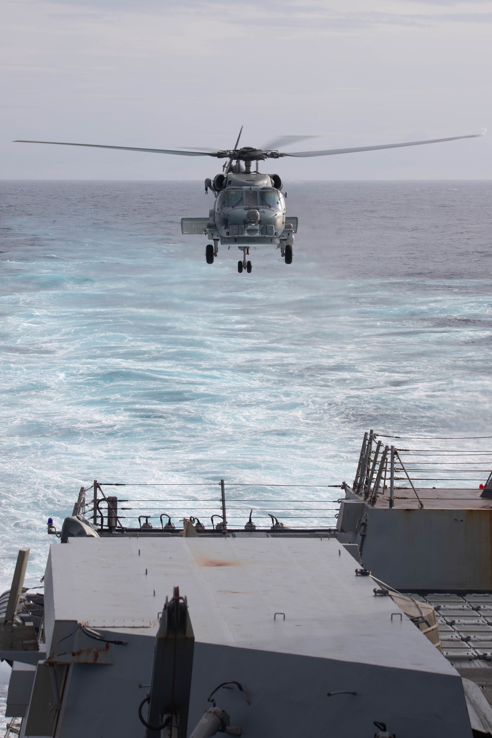 U.S. Navy MH-60R lands on USS Chung-Hoon