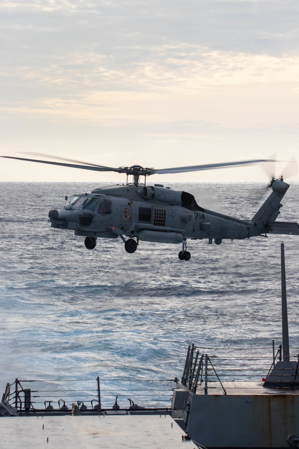 U.S. Navy MH-60R takes off from USS Chung-Hoon