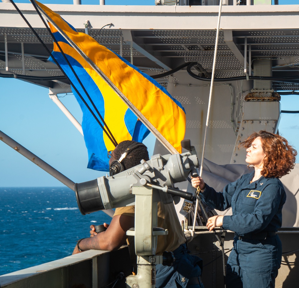 Sailor Raises Signal Flag