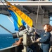 Sailor Raises Signal Flag