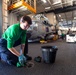 U.S. Navy Sailor Cleans Padeyes