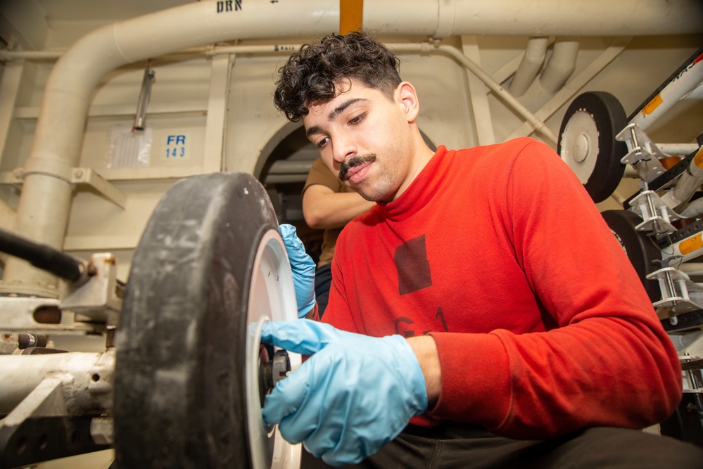 Sailor Reassembles Ordnance Skid