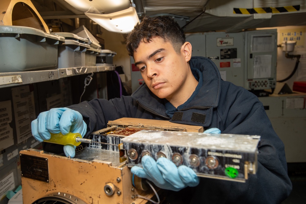 Sailor Inspects Jet Components