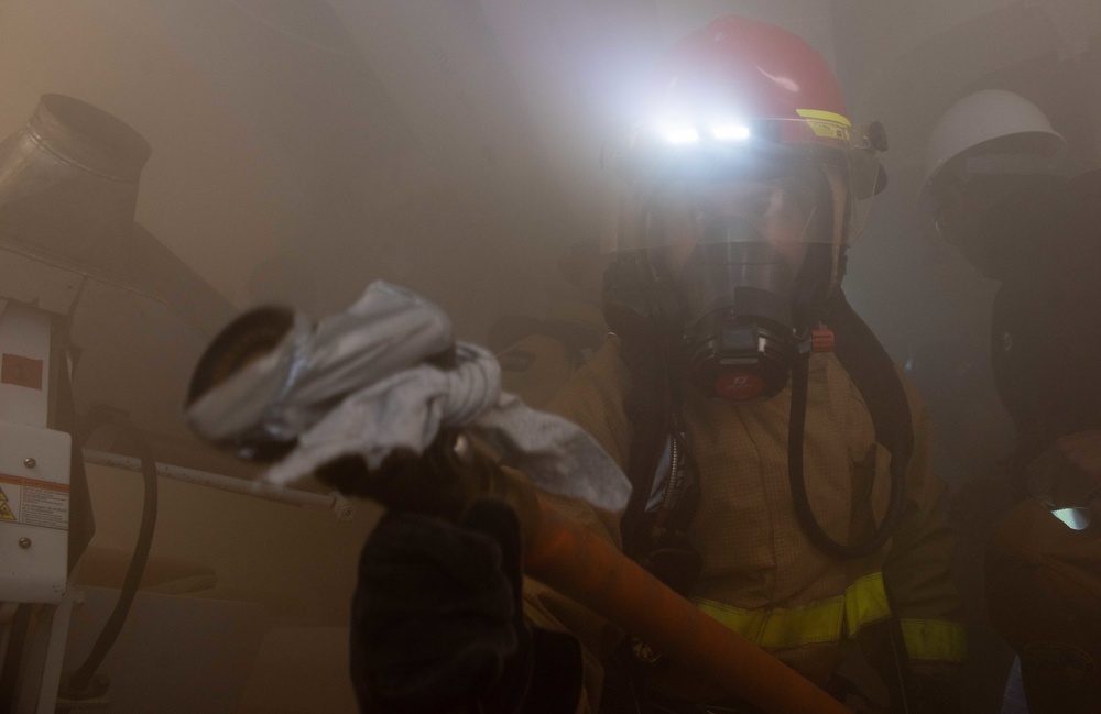 USS Ronald Reagan (CVN 76) conducts a joint damage control drill