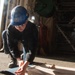 USS Ronald Reagan (CVN-76) Sailors prepare electrical matting