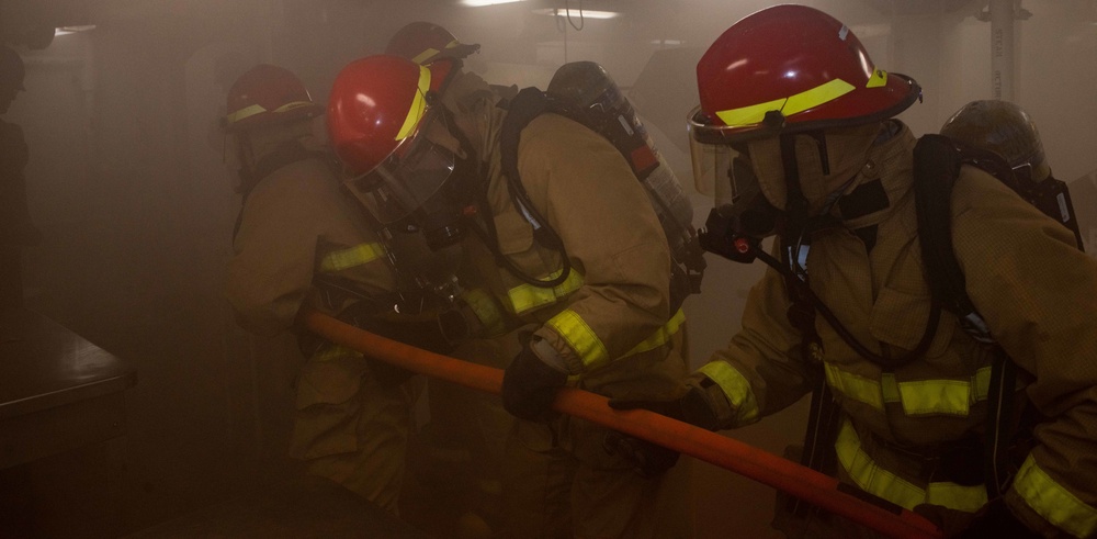 USS Ronald Reagan (CVN 76) conducts a joint damage control drill