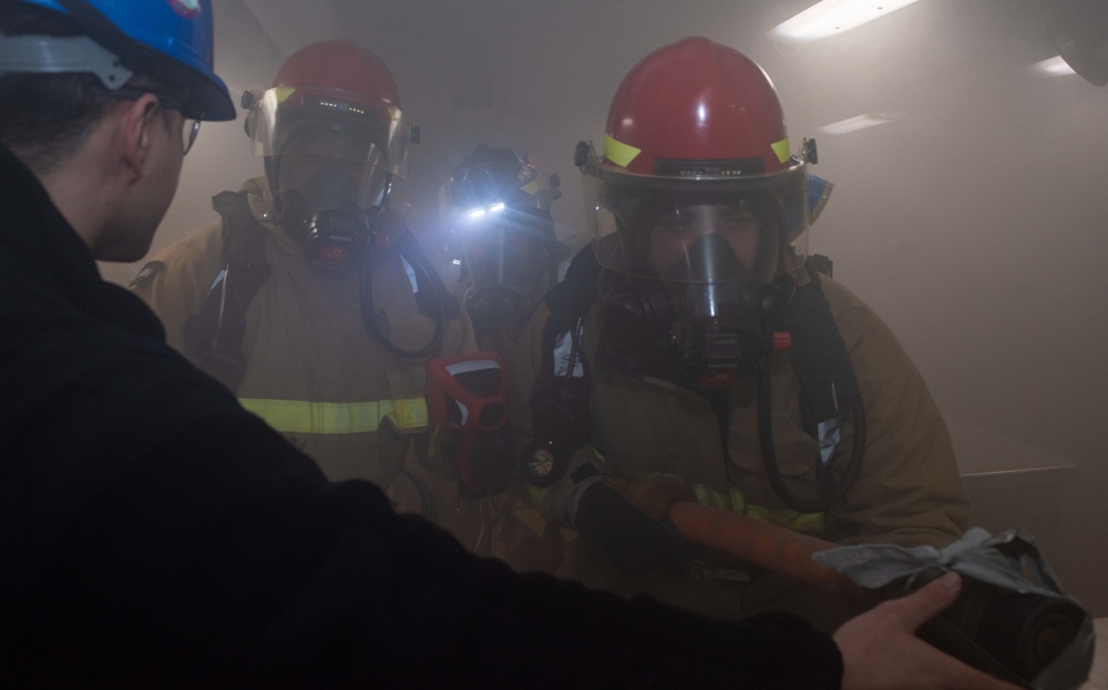 USS Ronald Reagan (CVN 76) conducts a joint damage control drill