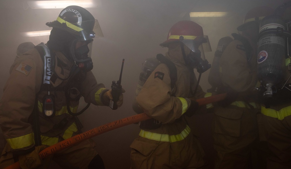 USS Ronald Reagan (CVN 76) conducts a joint damage control drill