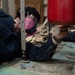 USS Ronald Reagan (CVN 76) Sailors remove floor tiles