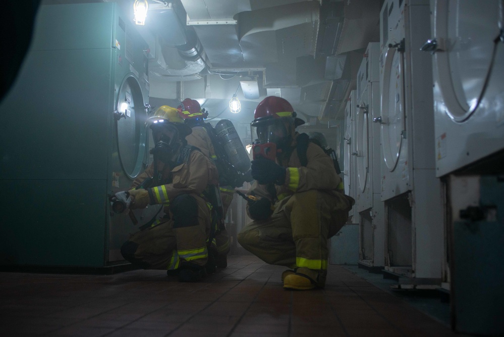 USS Ronald Reagan (CVN 76) conducts a joint damage control drill