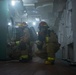 USS Ronald Reagan (CVN 76) conducts a joint damage control drill