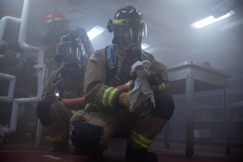 USS Ronald Reagan (CVN 76) conducts a joint damage control drill