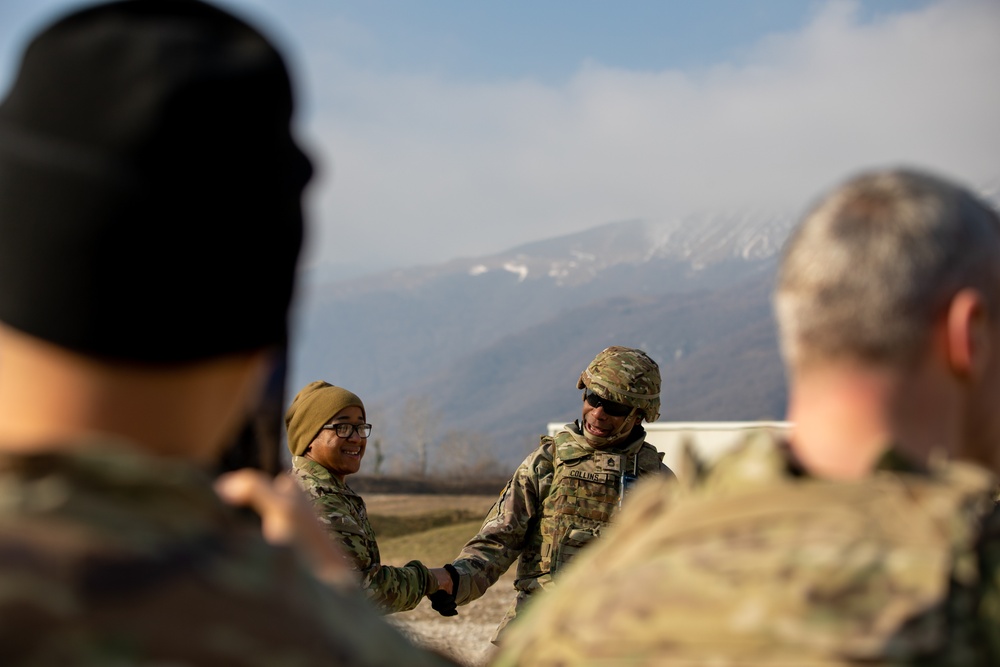 Sgt. 1st Class Kylon R. Collins earns coin during SETAF-AF Marksmanship Training