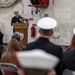 Vice Adm. Kitchener speaks at USS Arlington Sailor's retirement