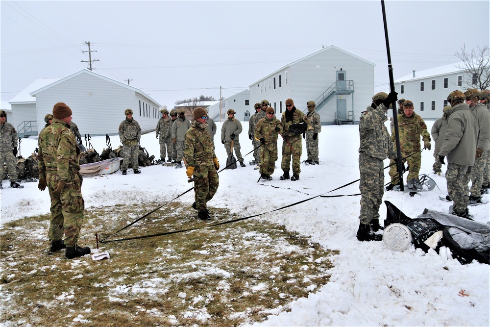 Tent-building among skills Airmen learned during January cold-weather training at Fort McCoy
