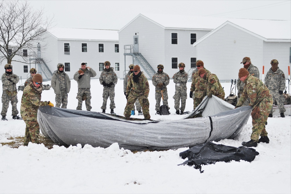 Tent-building among skills Airmen learned during January cold-weather training at Fort McCoy