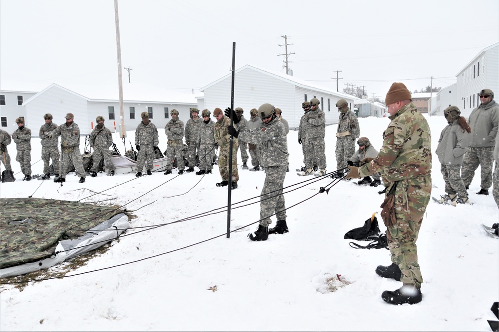 Tent-building among skills Airmen learned during January cold-weather training at Fort McCoy