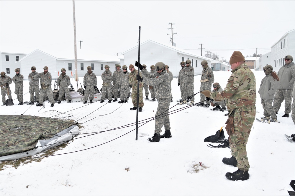 Tent-building among skills Airmen learned during January cold-weather training at Fort McCoy