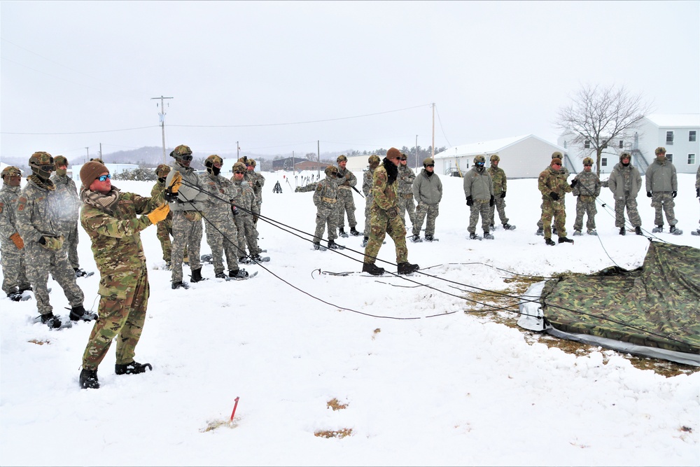 Tent-building among skills Airmen learned during January cold-weather training at Fort McCoy