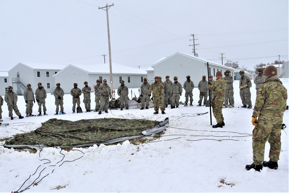 Tent-building among skills Airmen learned during January cold-weather training at Fort McCoy