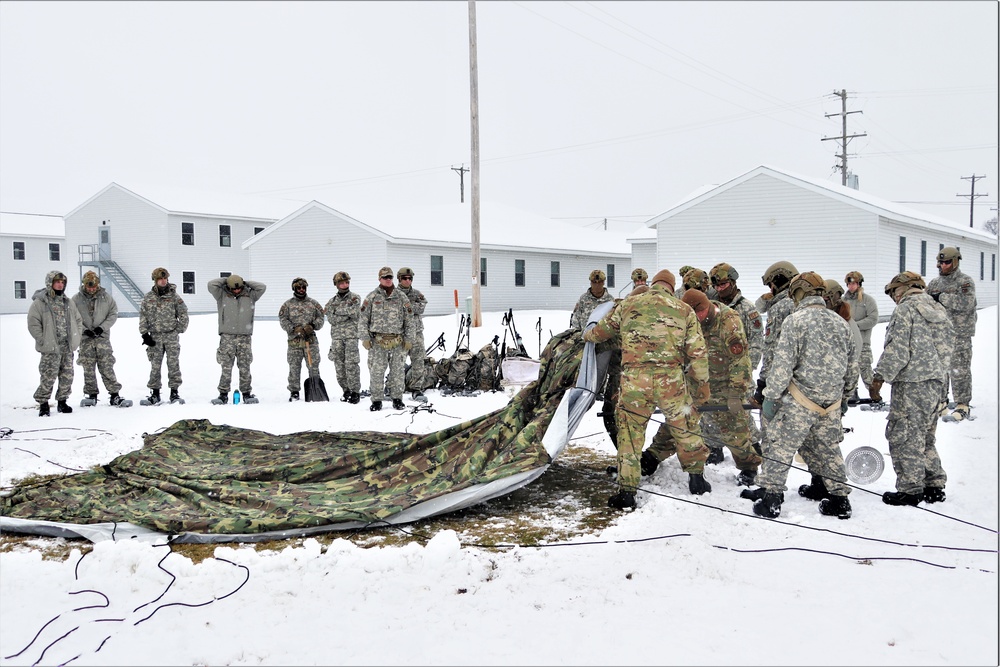Tent-building among skills Airmen learned during January cold-weather training at Fort McCoy