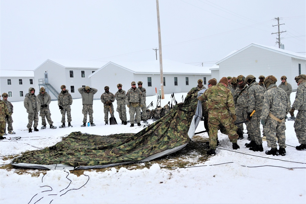 Tent-building among skills Airmen learned during January cold-weather training at Fort McCoy