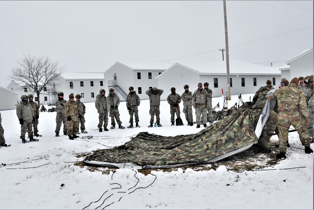 Tent-building among skills Airmen learned during January cold-weather training at Fort McCoy