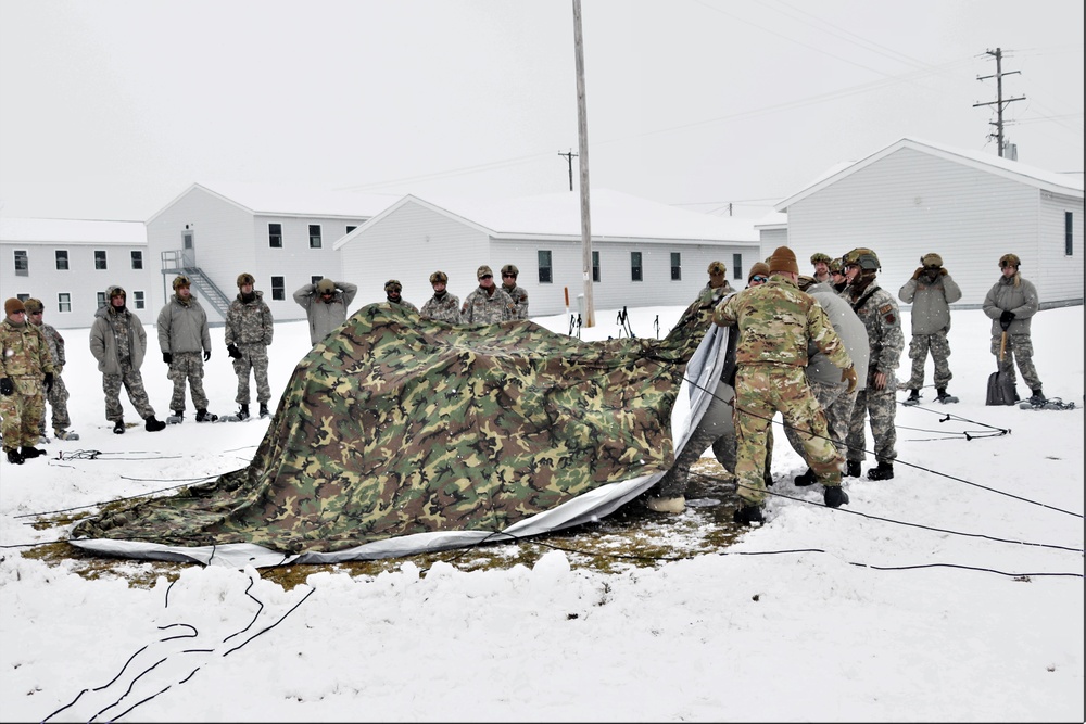Tent-building among skills Airmen learned during January cold-weather training at Fort McCoy